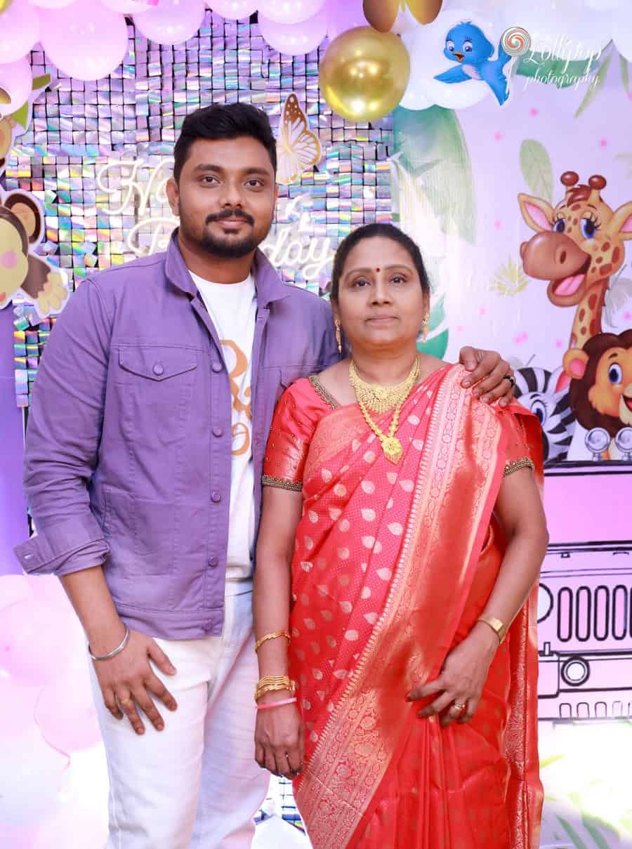 A heartfelt moment between mother and son, taken at Sarah's birthday celebration, courtesy of Lollipop Photography