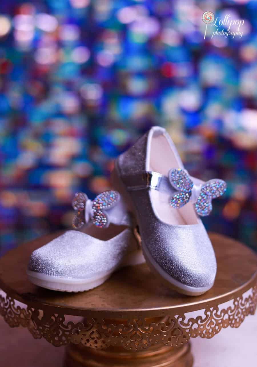 Beautiful purple rosette dress for Sarah's birthday photoshoot, adding a touch of elegance. Lollipop Photography