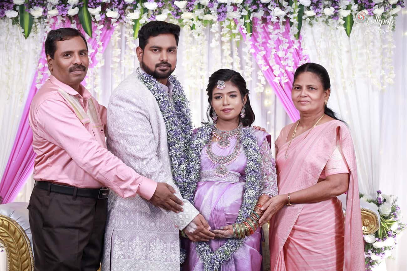 A touching family moment as the expectant parents pose with loved ones, cherishing the joy of their baby shower in Coimbatore.