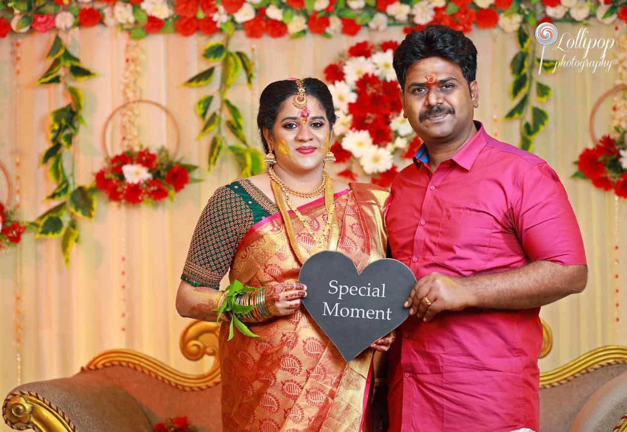 Hemalatha and her husband sharing a special moment at their baby shower, captured in Coimbatore by Lollipop Photography