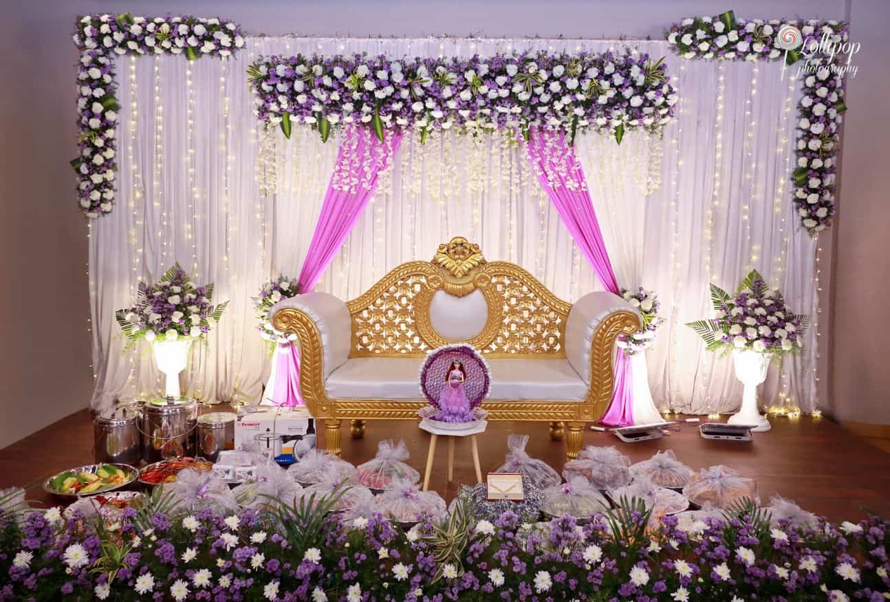 The lavish floral and lighting decor at Suganthi’s baby shower celebration in Chennai, adding a touch of elegance to the setting