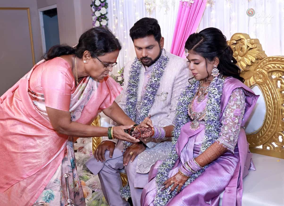 A loving mother offers blessings to her daughter during the baby shower ceremony in Coimbatore, captured by Lollipop Photography