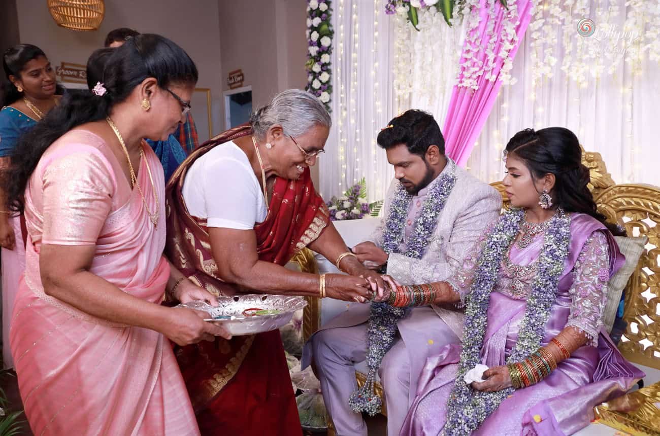 Family elders perform traditional rituals, bestowing blessings upon the expectant couple at the baby shower celebration in Coimbatore.